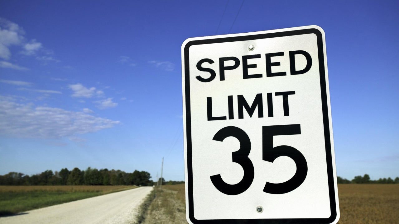 Speed limit sign in rural setting