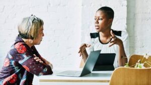 A financial advisor meets with a client.