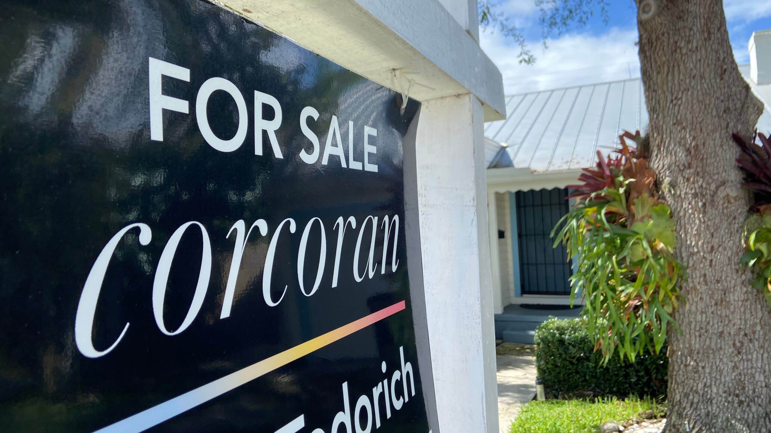 A close-up on a home for sale sign