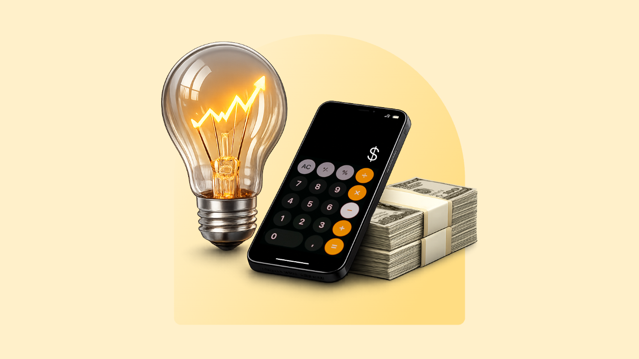 A lightbulb, cell phone and pile of $100 bils rest on a yellow background